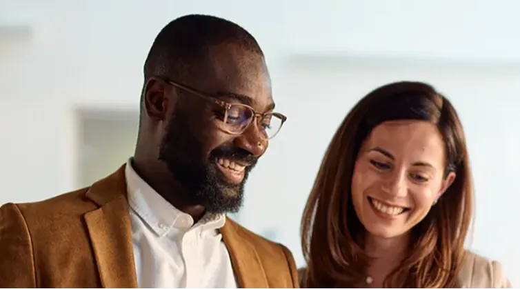 business administration students looking at tablet