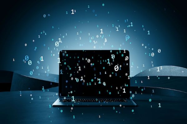 computer technology icons floating in front of laptop