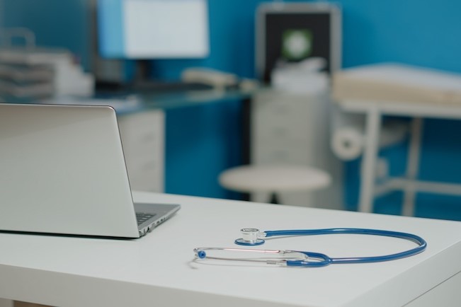 stethoscope near laptop