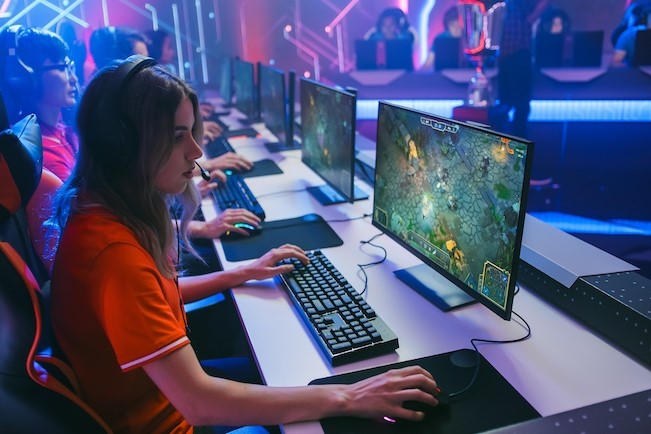 esport degree student sitting at computer