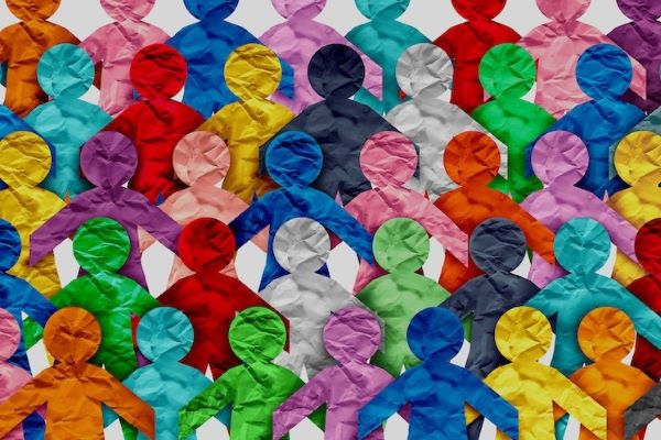 Colorful paper cutout silhouettes of people overlapping