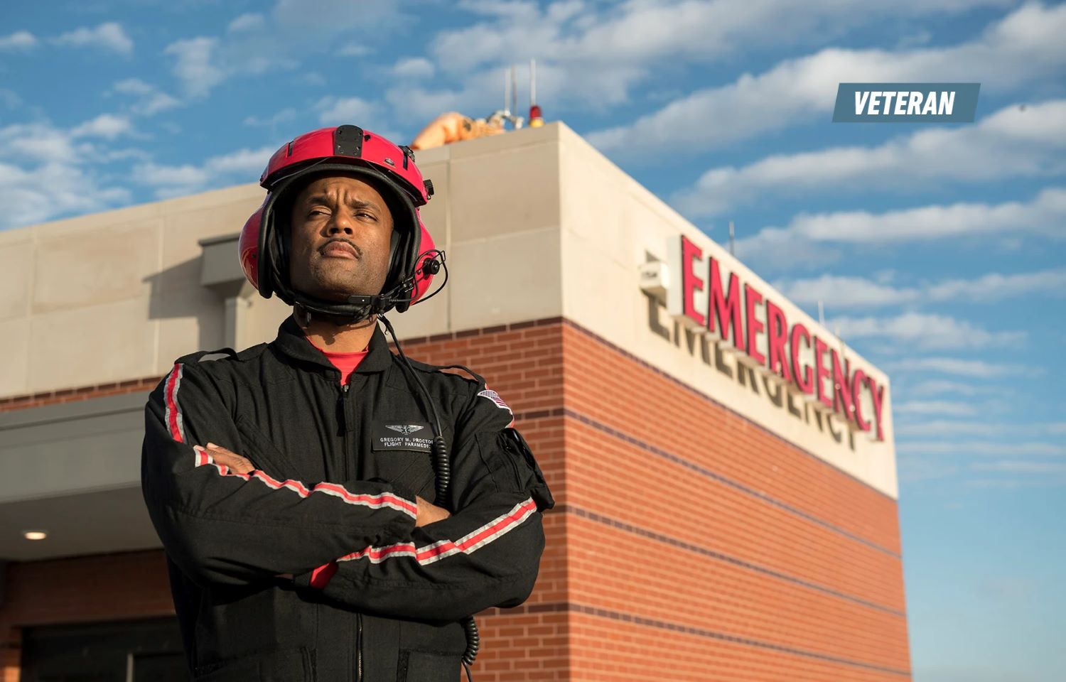 Gregory Proctor Standing in Front of Building