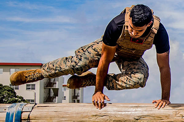 military student on agility course
