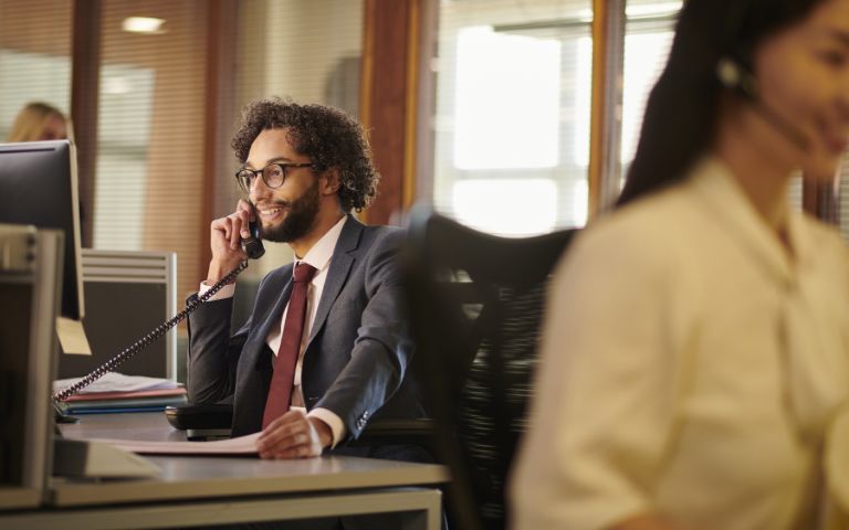 legal studies graduate speaking on phone